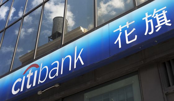 FILE- In this April 24, 2018, file photo a Citibank sign is shown outside one of the bank&#39;s branch offices in New York. On Monday, Jan. 14, 2019, Citigroup Inc. reports financial results. (AP Photo/Mark Lennihan, File)