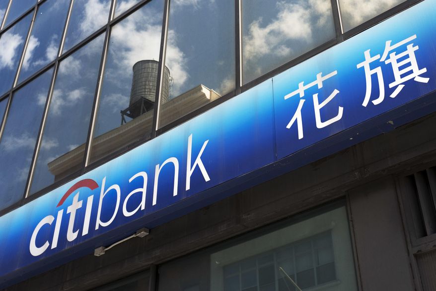 FILE- In this April 24, 2018, file photo a Citibank sign is shown outside one of the bank&#39;s branch offices in New York. On Monday, Jan. 14, 2019, Citigroup Inc. reports financial results. (AP Photo/Mark Lennihan, File)