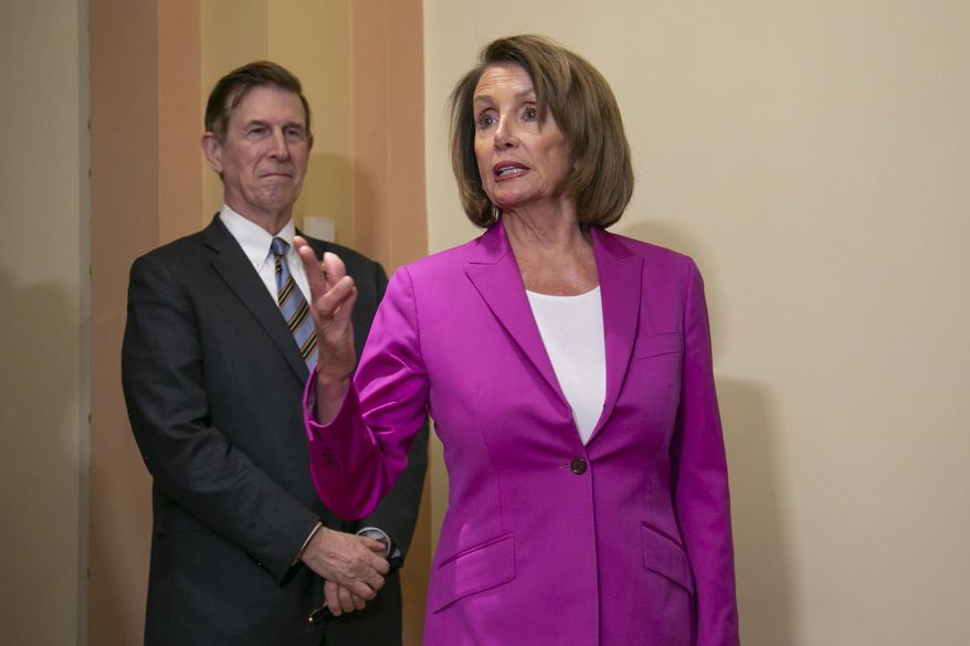 Speaker of the House Nancy Pelosi, D-Calif., joined at left by Rep. Don Beyer D-Va., talks to reporters after signing a House-passed a bill requiring that all government workers receive retroactive pay after the partial shutdown ends, at the Capitol in Washington, Friday, Jan. 11, 2019. (AP Photo/J. Scott Applewhite) **FILE**