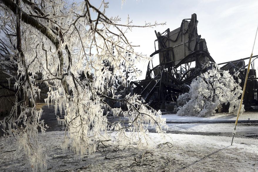 In this Sunday, Jan. 13, 2019, photo icicles form on a tree after a fire broke out at the American Shakespeare Theatre in Stratford, Conn. The theatre opened in 1955 and during the 1960s and 1970s, famous actors, including Katharine Hepburn, performed on its stage. The American Shakespeare Festival Theatre held its final full season in the building in 1982. (Ned Gerard/Hearst Connecticut Media via AP)