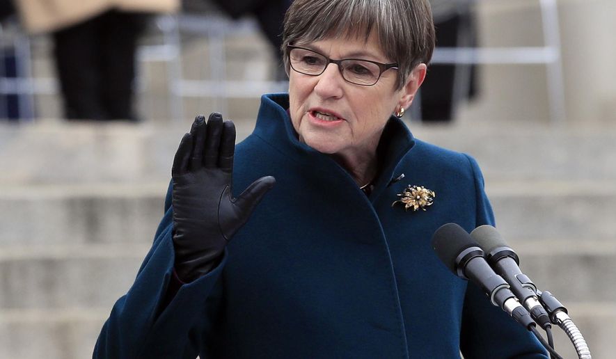 Gov. Laura Kelly delivers her inaugural address on the Statehouse steps in Topeka, Kan., Monday, Jan. 14, 2019. (AP Photo/Orlin Wagner)