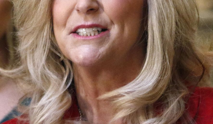 Mississippi's Republican second-term state treasurer Lynn Fitch, announces at a Monday, Jan. 14, 2019 news conference at the Capitol in Jackson, Miss., that she is running for attorney general because she wants to protect gun rights, fight opioid abuse and crack down on human trafficking, Fitch of Ridgeland is traveling the state this week to discuss her candidacy for the state's top legal job. (AP Photo/Rogelio V. Solis)