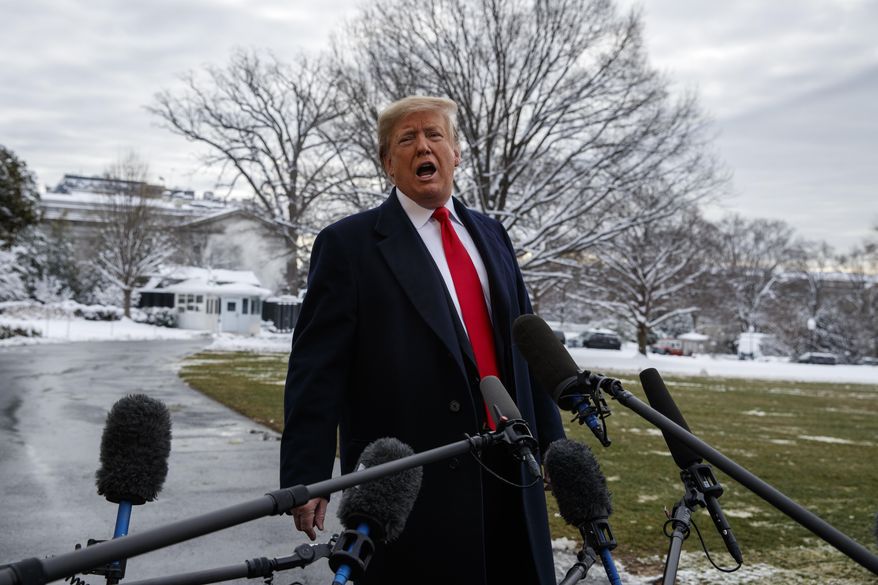 President Donald Trump talks with reporters on the South Lawn of the White House before departing for the American Farm Bureau Federation's 100th Annual Convention in New Orleans, Monday, Jan. 14, 2019, in Washington. (AP Photo/ Evan Vucci)