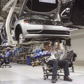 In this July 12, 2013, photo, employees at the Volkswagen plant in Chattanooga, Tenn., work on the assembly of Passat sedans. (AP Photo/Erik Schelzig) **FILE**