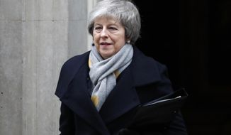 Britain&#39;s Prime Minister Theresa May leaves a cabinet meeting at Downing Street in London, Tuesday, Jan. 15, 2019. May is struggling to win support for her Brexit deal in Parliament. Lawmakers are due to vote on the agreement Tuesday, and all signs suggest they will reject it, adding uncertainty to Brexit less than three months before Britain is due to leave the EU on March 29. (AP Photo/Frank Augstein)