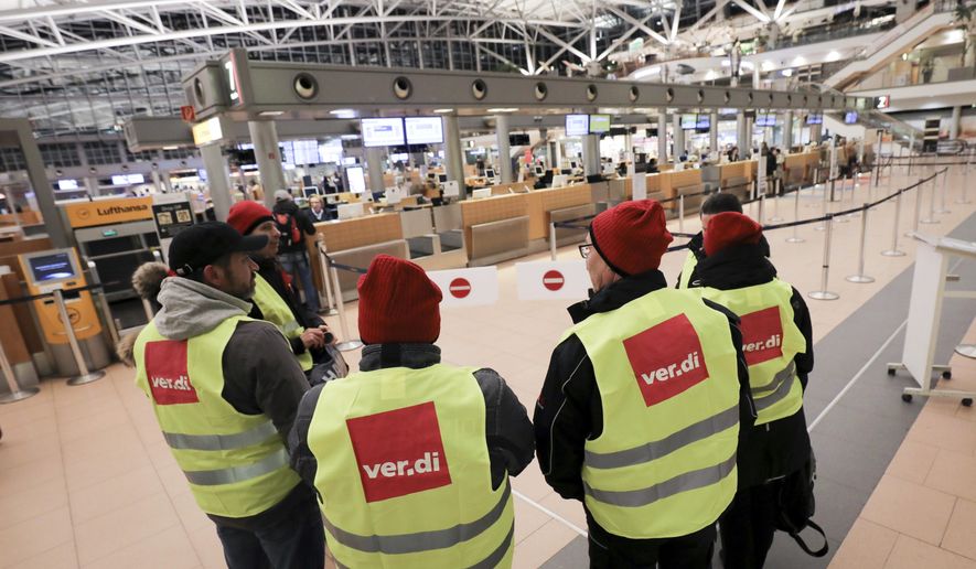 Members of the security staff are on strike at the airport in Hamburg, Germany, Tuesday, Jan. 15, 2019. Flights across Germany are facing disruption after security staff at eight airports went on strike over pay. (Christian Charisius/dpa via AP)