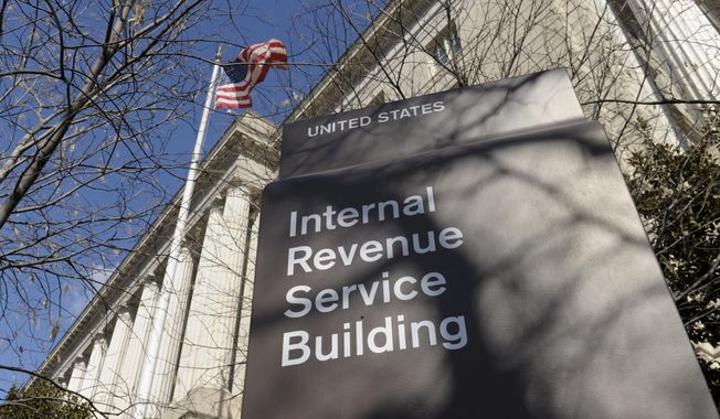 This March 22, 2013, file photo, shows the exterior of the Internal Revenue Service building in Washington.  (AP Photo/Susan Walsh, File) 