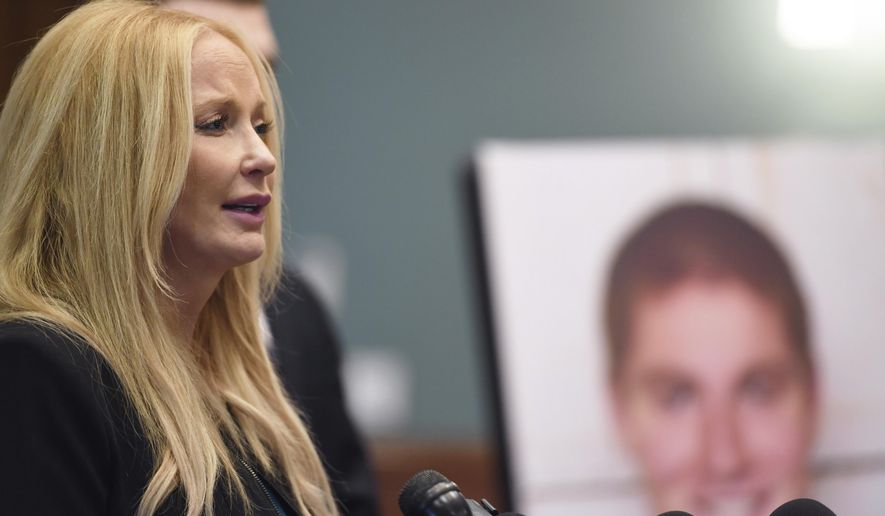 FILE - In this Dec. 15, 2017, file photo, District Attorney Stacy Parks Miller holds a news conference regarding a grand jury's report in the wake of a fraternity pledge's drinking death at the Courthouse Annex in Bellefonte, Pa. Pennsylvania colleges and universities began Tuesday, Jan. 15, 2019, to post online reports of forced drinking, humiliating rituals that one case included toe-licking, dunking students in ice water as a punishment and other hazing under a new state law passed because of the death of a Penn State fraternity pledge. (Phoebe Sheehan/Centre Daily Times via AP, File)