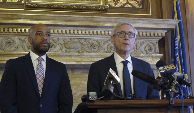 Wisconsin Democratic Gov. Tony Evers, right, says he told told Republican lawmakers during a private meeting that he will push for Medicaid expansion, but won&#x27;t propose eliminating the state&#x27;s economic development agency, on Tuesday, Jan. 15, 2019, in Madison, Wis. Standing at left is Lt. Gov. Mandela Barnes. (AP Photo/Scott Bauer)