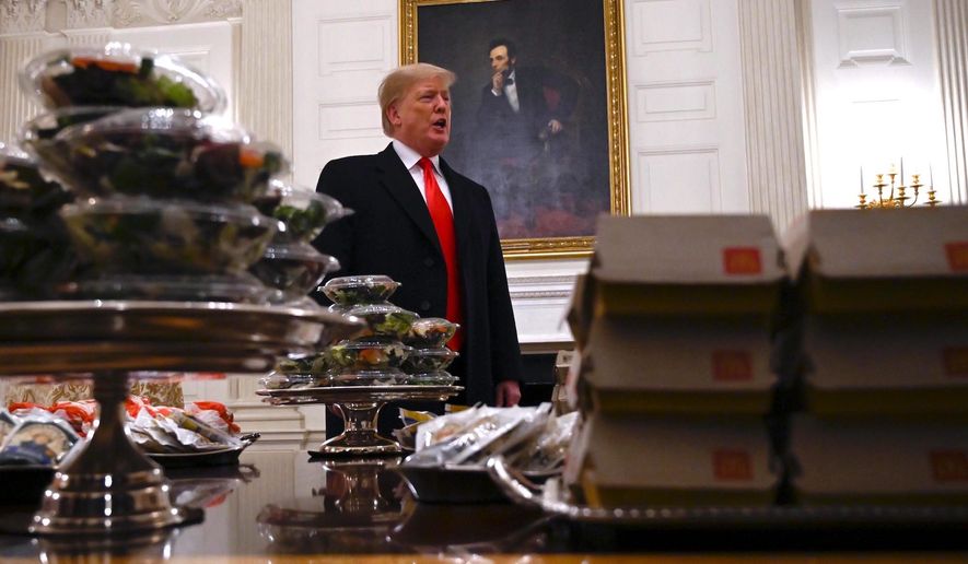 President Trump treated the Clemson football team to a fast food feast on Monday at the White House, one which caused his critics to cringe. (Associated Press)
