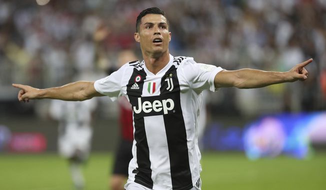 Juventus' Cristiano Ronaldo celebrates after scoring his side's opening goal during the Italian Super Cup final soccer match between AC Milan and Juventus at King Abdullah stadium in Jiddah, Saudi Arabia, Wednesday, Jan. 16, 2019. (AP Photo)