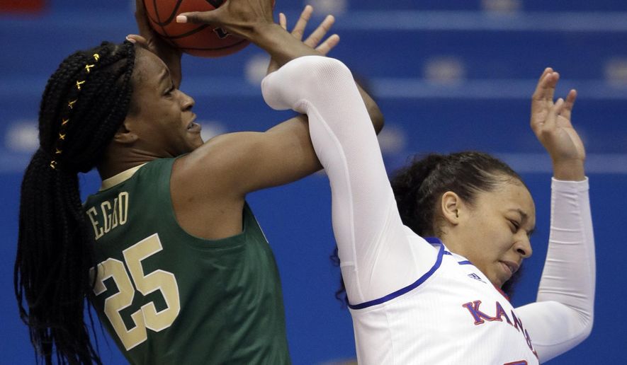 Baylor center Queen Egbo (25) rebounds against Kansas center Chelsea Lott (1) during the first half of an NCAA college basketball game in Lawrence, Kan., Wednesday, Jan. 16, 2019. (AP Photo/Orlin Wagner)