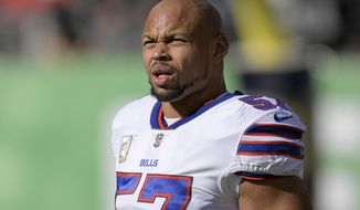 FILE - In this Nov. 11, 2018, file photo, Buffalo Bills outside linebacker Lorenzo Alexander warms up before an NFL football game against the New York Jets, in East Rutherford, N.J. The Bills have re-signed veteran linebacker Lorenzo Alexander to a one-year contract. The signing Wednesday, Jan. 16, 2019, comes as no surprise after both sides ended the season openly discussing the likelihood of the 35-year-old returning for a fourth season in Buffalo.(AP Photo/Bill Kostroun, File)