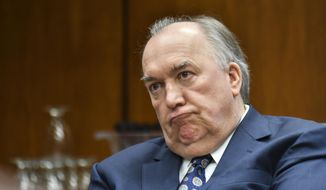 In this Feb. 16, 2018, file photo, Michigan State University interim President John Engler listens as he runs his first Michigan State University Board of Trustees meeting on campus in East Lansing, Mich. Engler will resign as interim president of Michigan State University amid a public backlash over his comments about women and girls sexually assaulted by now-imprisoned campus sports doctor Larry Nassar, a member of the school&#39;s Board of Trustees said Wednesday, Jan. 16, 2019. (Matthew Dae Smith/Lansing State Journal via AP, File)