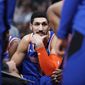 FILE - In this Jan. 1, 2019, file photo, New York Knicks center Enes Kanter jokes with teammates during a timeout the first half of the team&#39;s NBA basketball game against the Denver Nuggets, in Denver. Turkish prosecutors are seeking an international arrest warrant for Knicks player Enes Kanter, accusing him of membership in a terror organization. (AP Photo/David Zalubowski, File)