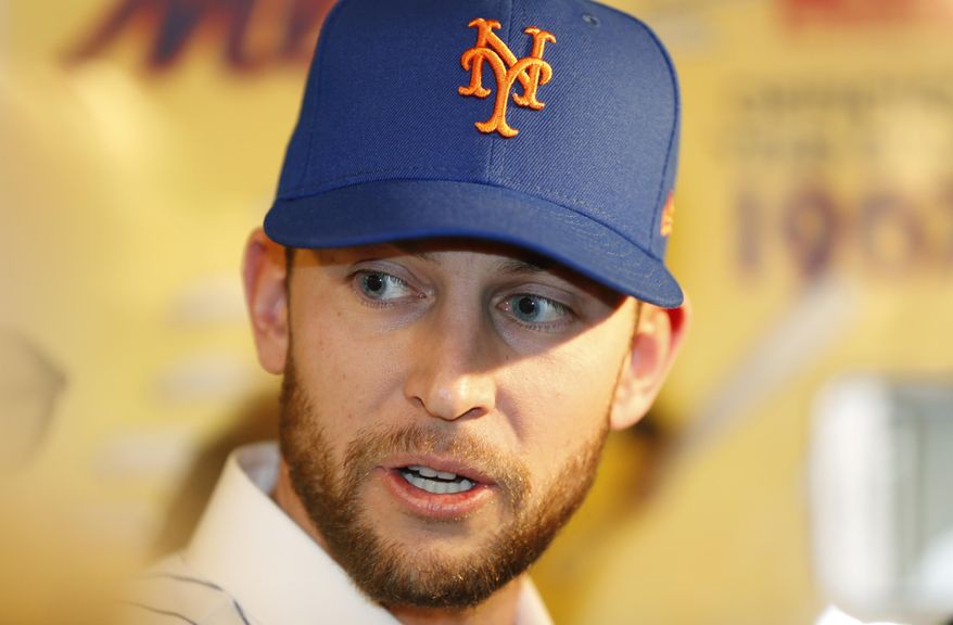 Newly signed New York Mets infielder Jed Lowrie speaks to the media at CitiField following a press conference introducing him, Wednesday, Jan. 16, 2019, in New York. Lowrie and the New York Mets finalized a $20 million, two-year contract. The switch-hitter, who turns 35 in April, is coming off his first All-Star season. (AP Photo/Kathy Willens)