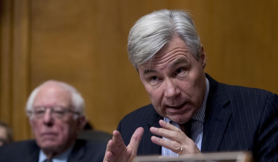 Sen. Sheldon Whitehouse, D-R.I., right, accompanied by Sen. Bernie Sanders, I-Vt., left, questions Andrew Wheeler as he testifies at a Senate Environment and Public Works Committee hearing to be the administrator of the Environmental Protection Agency, on Capitol Hill in Washington, Wednesday, Jan. 16, 2019. (AP Photo/Andrew Harnik) ** FILE **