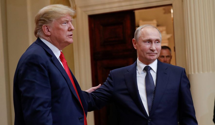 U.S. President Donald Trump (left) and Russian President Vladimir Putin (right) leave the stage together at the conclusion of their joint news conference at the Presidential Palace in Helsinki, Finland, on July 16, 2018. (AP Photo/Pablo Martinez Monsivais) **FILE**