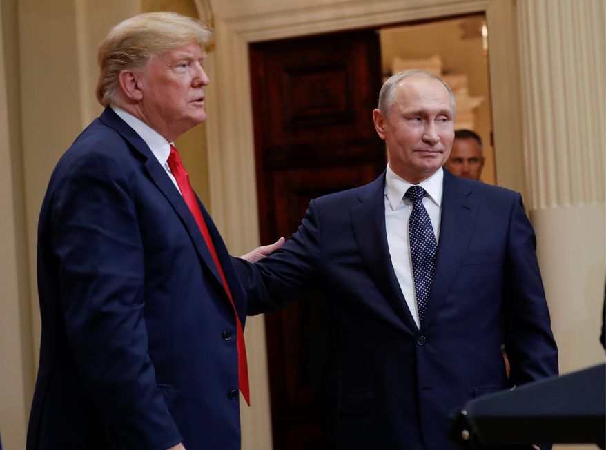 U.S. President Donald Trump (left) and Russian President Vladimir Putin (right) leave the stage together at the conclusion of their joint news conference at the Presidential Palace in Helsinki, Finland, on July 16, 2018. (AP Photo/Pablo Martinez Monsivais) **FILE**