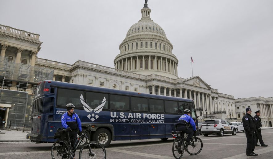 An Air Force bus waits on the plaza of the Capitol after President Donald Trump used his executive power to deny military aircraft to House Speaker Nancy Pelosi just before she was depart to visit troops abroad, on Capitol Hill in Washington, Thursday, Jan. 17, 2019.(AP Photo/J. Scott Applewhite)