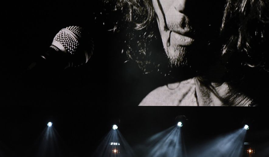 Toni Cornell, daughter of the late singer Chris Cornell, performs with Ziggy Marley, bottom left, underneath a video image of her father during &amp;quot;I Am The Highway: A Tribute to Chris Cornell&amp;quot; at The Forum, Wednesday, Jan. 16, 2019, in Inglewood, Calif. (Photo by Chris Pizzello/Invision/AP)