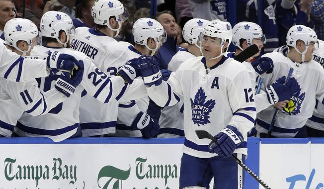 Toronto Maple Leafs center Patrick Marleau (12) celebrates with the bench after his goal against the Tampa Bay Lightning during the second period of an NHL hockey game, Thursday, Jan. 17, 2019, in Tampa, Fla. (AP Photo/Chris O&#x27;Meara)