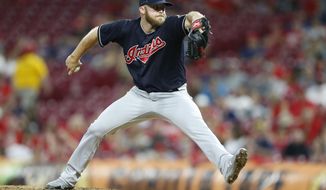 FILE - In this Aug. 15, 2018, file photo, Cleveland Indians relief pitcher Cody Allen throws against the Cincinnati Reds during the eighth inning of a baseball game, in Cincinnati. A person familiar with the negotiations says closer Cody Allen and the Los Angeles Angels have agreed to an $8.5 million, one-year contract. The person spoke to The Associated Press on condition of anonymity Friday, Jan. 18, 2019, because the deal was subject to a successful physical. (AP Photo/Gary Landers, File)