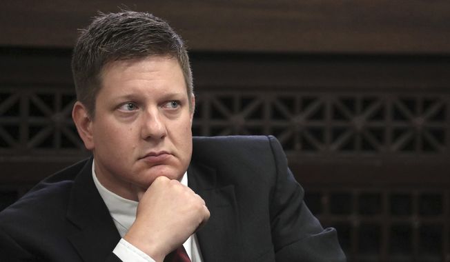 In this Thursday, Sept. 6, 2018, file photo, Chicago police Officer Jason Van Dyke, charged with first-degree murder in the shooting of black teenager Laquan McDonald in 2014, listens during a hearing at the Leighton Criminal Court Building in Chicago. Van Dyke was convicted in October of second-degree murder and 16 counts of aggravated battery. (Antonio Perez/Chicago Tribune via AP, Pool, File)