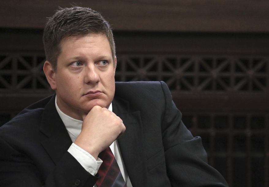 In this Thursday, Sept. 6, 2018, file photo, Chicago police Officer Jason Van Dyke, charged with first-degree murder in the shooting of black teenager Laquan McDonald in 2014, listens during a hearing at the Leighton Criminal Court Building in Chicago. Van Dyke was convicted in October of second-degree murder and 16 counts of aggravated battery. (Antonio Perez/Chicago Tribune via AP, Pool, File)