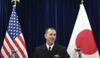 Chief of U.S. Naval Operations Adm. John Richardson talks to reporters on regional security issues in Tokyo Friday, Jan. 18, 2019. The U.S. Navy’s top officer says he urged China to follow international rules at sea to avoid confrontations and insisted that ships should be able to pass safely though disputed areas of the South China Sea and Taiwan Strait. (AP Photo/Mari Yamaguchi)