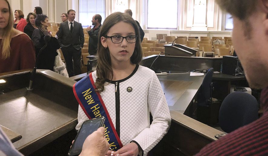 Lola Giannelli, New Hampshire's first "Kid Governor" answers questions at a news conference after her inauguration Friday, Jan. 18, 2019, at the Statehouse in Concord, N.H. The fifth-grader from Nashua was elected as part of civics program created by the Connecticut Democracy Center. (AP Photo/Holly Ramer)