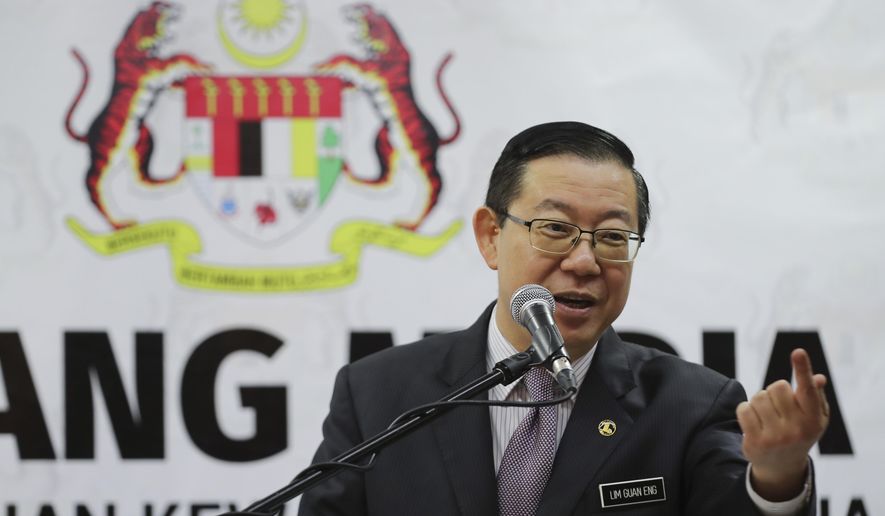Malaysian Finance Minister Lim Guan Eng speaks during a press conference at Finance Ministry in Putrajaya, Malaysia, Friday, Jan. 18, 2019. Lim said the apology by Goldman Sachs for its role in the alleged multibillion-dollar ransacking of state investment fund 1MDB was insufficient and that it has to pay $7.5 billion as compensation. (AP Photo/Vincent Thian)
