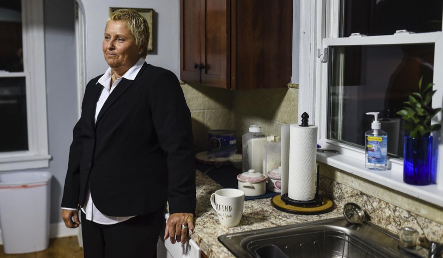 In this March 12, 2018 photo, Lisa Livingston takes a moment to herself while having her last cup of coffee before heading out to the Orange County Courthouse in Paoli, Ind., for her sentencing. Livingston, the founder of a drug recovery home for women in southern Indiana, was released from prison Wednesday, Jan. 16, 2019, just weeks after the state's high court revised her original 30-year drug-related sentence. (Tyler Stewart/News and Tribune via AP)