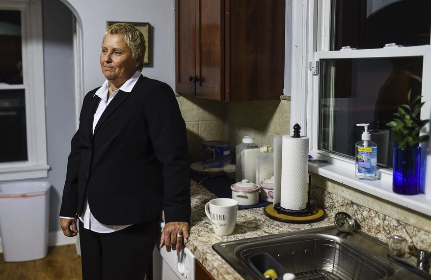 In this March 12, 2018 photo, Lisa Livingston takes a moment to herself while having her last cup of coffee before heading out to the Orange County Courthouse in Paoli, Ind., for her sentencing. Livingston, the founder of a drug recovery home for women in southern Indiana, was released from prison Wednesday, Jan. 16, 2019, just weeks after the state's high court revised her original 30-year drug-related sentence. (Tyler Stewart/News and Tribune via AP)