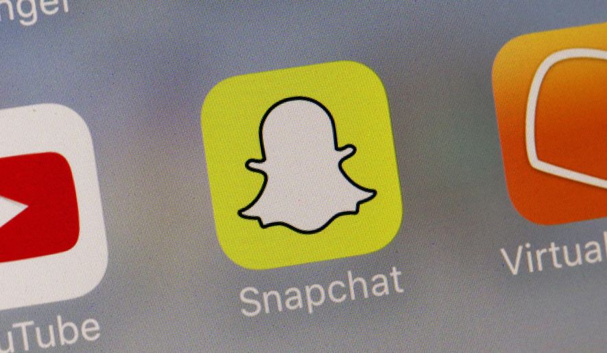 This Wednesday, Aug. 9, 2017, file photo shows the Snapchat app.  (AP Photo/Richard Drew, File) **FILE**