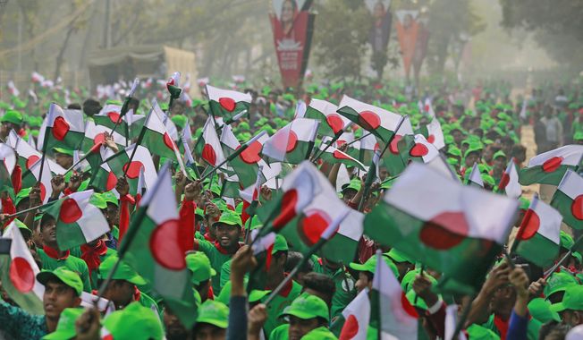 Supporters wave Awami League political party flags during a rally celebrating the party&#x27;s overwhelming victory in last month&#x27;s election in Dhaka, Bangladesh, Saturday, Jan. 19, 2019. (AP Photo)