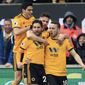 Wolverhampton Wanderers&#x27; Diogo Jota, right, celebrates with teammates scoring his side&#x27;s first goal of the game during the English Premier League soccer match between Wolverhampton Wanderers and Leicester at Molineux, Wolverhampton, England, Saturday, Jan. 19, 2019. (Mike Egerton/PA via AP)