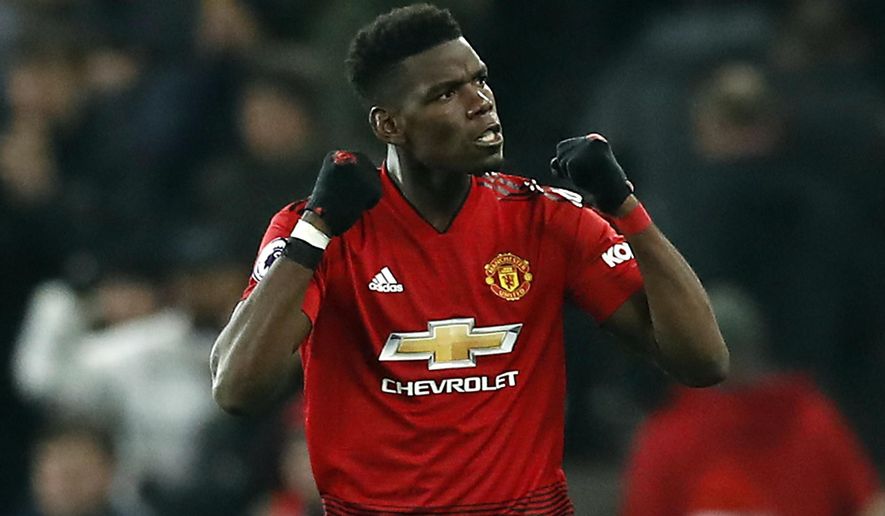 Manchester United's Paul Pogba celebrates after the final whistle of the English Premier League soccer match between Manchester United and Brighton at Old Trafford, Manchester, England, Saturday, Jan. 19, 2019. (Martin Rickett/PA via AP)