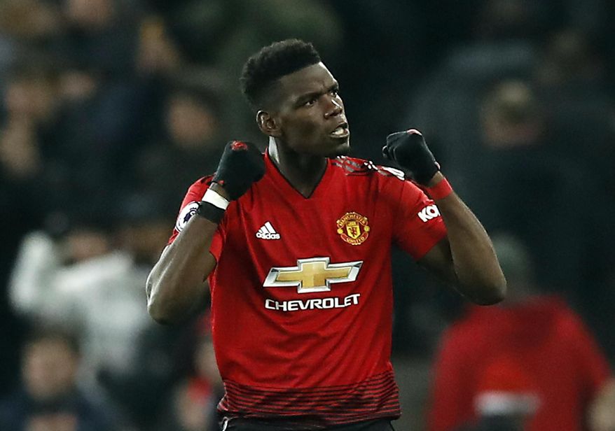 Manchester United's Paul Pogba celebrates after the final whistle of the English Premier League soccer match between Manchester United and Brighton at Old Trafford, Manchester, England, Saturday, Jan. 19, 2019. (Martin Rickett/PA via AP)
