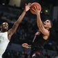 Louisville guard Christen Cunningham shoots as Georgia Tech guard Curtis Haywood II (13) defends during the first half of an NCAA college basketball game Saturday, Jan. 19, 2019 in Atlanta. (AP Photo/John Amis)