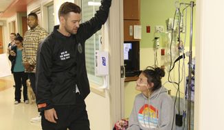 This photo provided by HCA Healthcare’s Methodist Children’s Hospital shows  Justin Timberlake visiting patients at the San Antonio, Texas hospital Friday, Jan. 18, 2019. (Anthony McCartney/HCA Healthcare’s Methodist Children’s Hospital via AP)