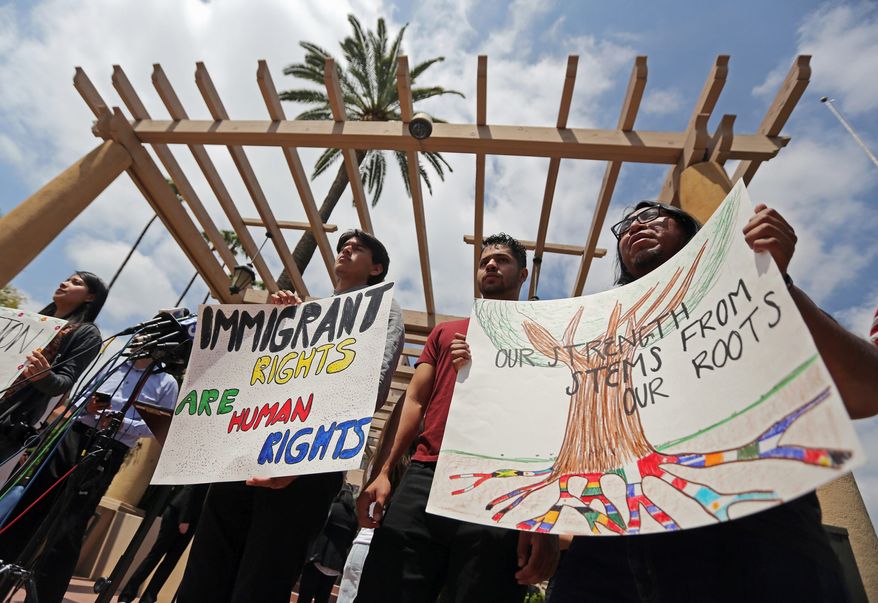 Activists demonstrate outside the U.S. District Court 9th Circuit in Pasadena, California, as the Trump administration tried to convince a U.S. appeals court that it was justified in ending an Obama-era immigration policy that shielded hundreds of thousands of young immigrants from deportation. (Associated Press/File)