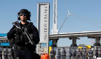 During a training drill, Customs and Border Protection officials block the entrance to the San Ysidro port of entry. (Associated Press/File)