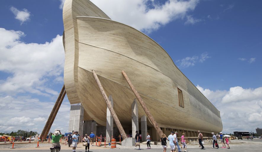 FILE - In this July 5, 2016, file photo, visitors pass outside the front of a replica Noah&#39;s Ark at the Ark Encounter theme park during a media preview day, in Williamstown, Ky. The AP reported Aug. 11, 2017, that an article claiming Christian fundamentalist Ken Ham wrote that atheists prayed for his ark attraction to fail is inaccurate. (AP Photo/John Minchillo, File)