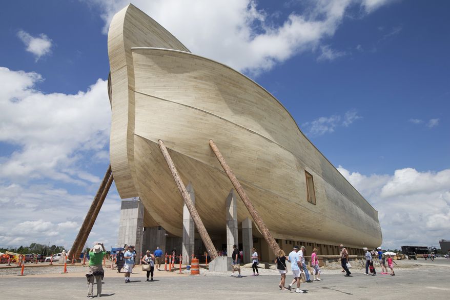 FILE - In this July 5, 2016, file photo, visitors pass outside the front of a replica Noah's Ark at the Ark Encounter theme park during a media preview day, in Williamstown, Ky. The AP reported Aug. 11, 2017, that an article claiming Christian fundamentalist Ken Ham wrote that atheists prayed for his ark attraction to fail is inaccurate. (AP Photo/John Minchillo, File)