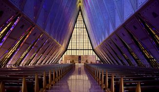 In this April 12, 2017, photo, light shines through the stained glass at the Cadet Chapel at the U.S. Air Force Academy outside Colorado Springs, Colo. The landmark Cadet Chapel is suffering from leaks and corrosion, so the school has drawn up the most ambitious restoration project in the building’s 55-year history. (AP Photo/Thomas Peipert)