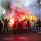 Protesters burn fireworks during a demonstration against the World Economic Forum (WEF) in Bern, Switzerland, Saturday, Jan. 19, 2019. The WEF will take place from January 22 till January 25 in Davos. (Peter Klaunzer/Keystone via AP)