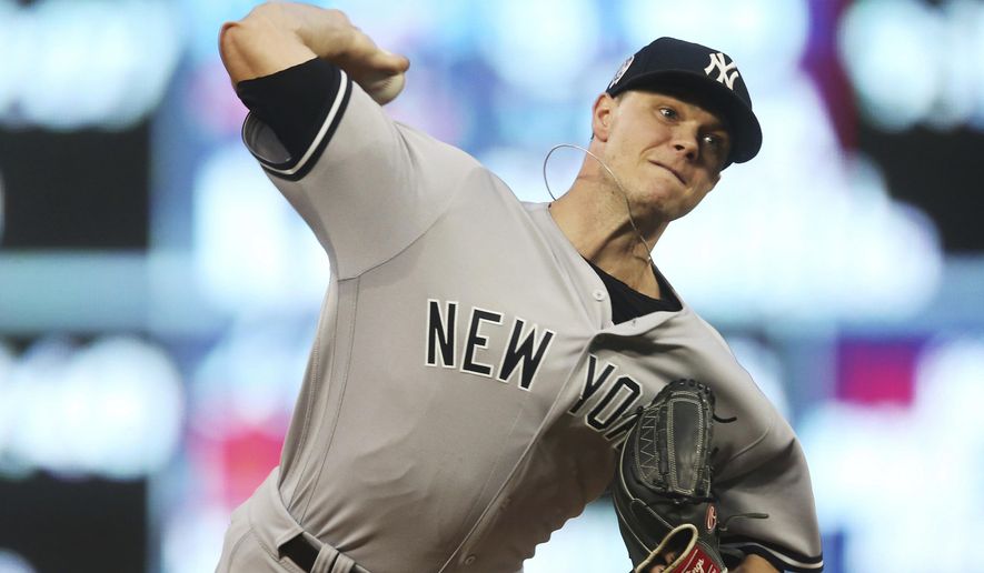 FILE - In this Sept. 11, 2018, file photo, New York Yankees pitcher Sonny Gray throws against the Minnesota Twins in the first inning of a baseball game in Minneapolis. A person familiar with the negotiations tells The Associated Press that Gray has agreed to a contract with Cincinnati adding $30.5 million from 2020-22, a deal that allows the Yankees to complete his trade to the Reds. The person spoke on condition of anonymity Monday, Jan. 21, 2019, because the trade had not been announced. (AP Photo/Jim Mone, File)