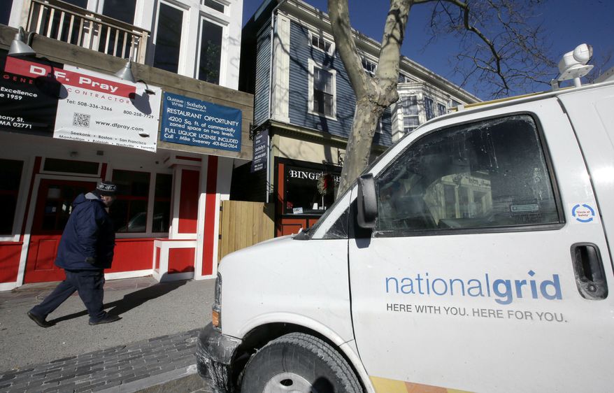 A pedestrian walks past businesses closed due to a natural gas outage on Tuesday, Jan. 22, 2019, in Newport, R.I. On Monday night, National Grid suspended service to roughly 7,100 customers in Newport and other parts of Aquidneck Island because of an issue from its supplier that caused low pressure outages. (AP Photo/Steven Senne)