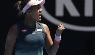 Japan&#39;s Naomi Osaka reacts after winning the first set against Ukraine&#39;s Elina Svitolina during their quarterfinal match at the Australian Open tennis championships in Melbourne, Australia, Wednesday, Jan. 23, 2019. (AP Photo/Kin Cheung)